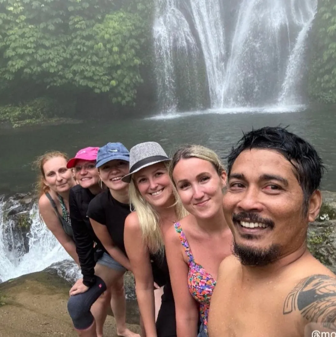 Group at a jungle waterfall in north Bali with Mougly